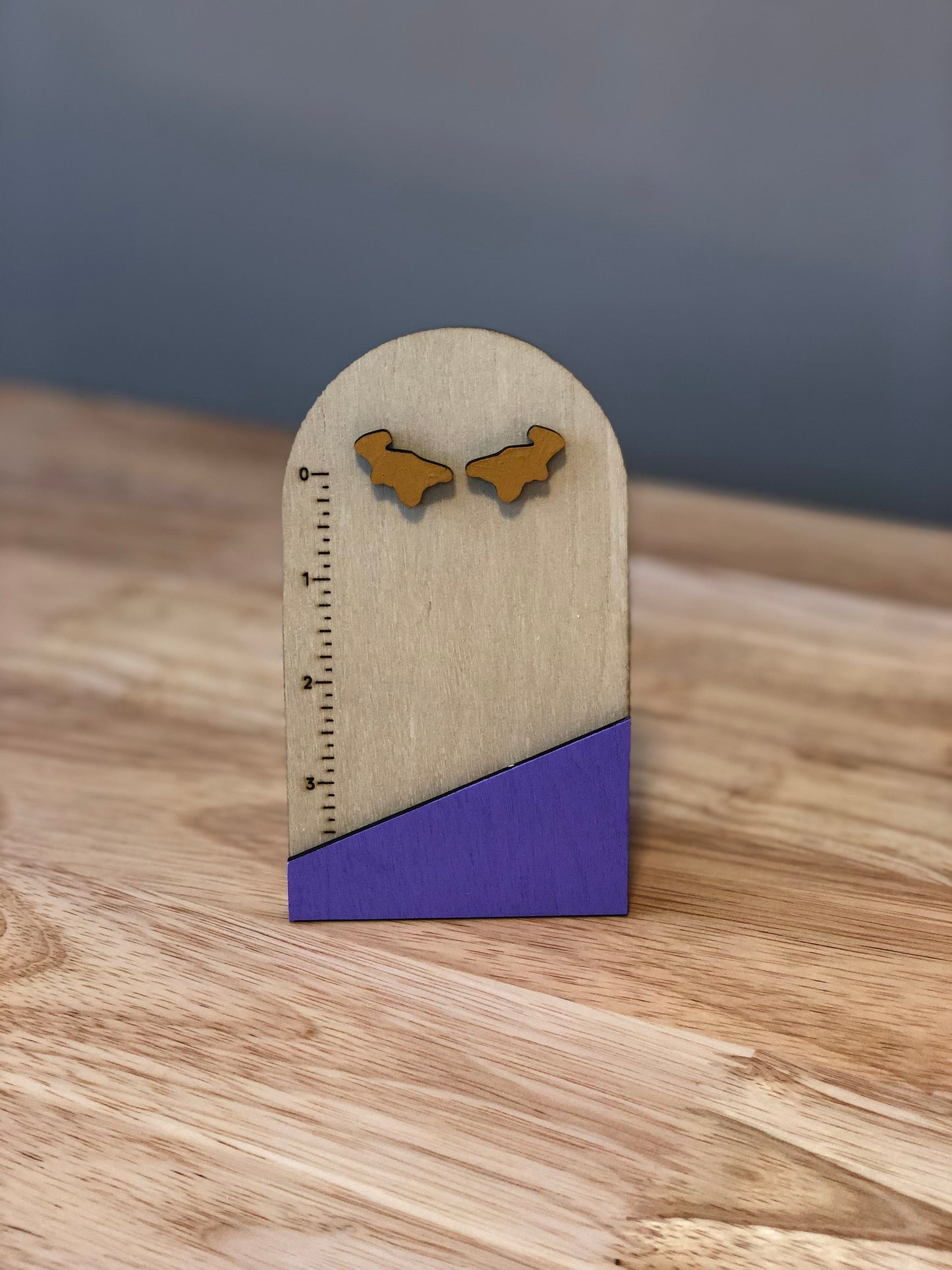 Dino nugget earrings hand made from wood.